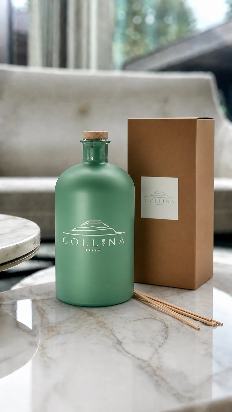 Collina 1L sage green home diffuser with cork cap and kraft box, front view