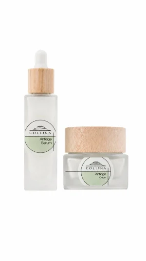 Antiage Serum 30ml con contagocce e Antiage Cream 50ml in vetro satinato con tappo in legno su sfondo bianco